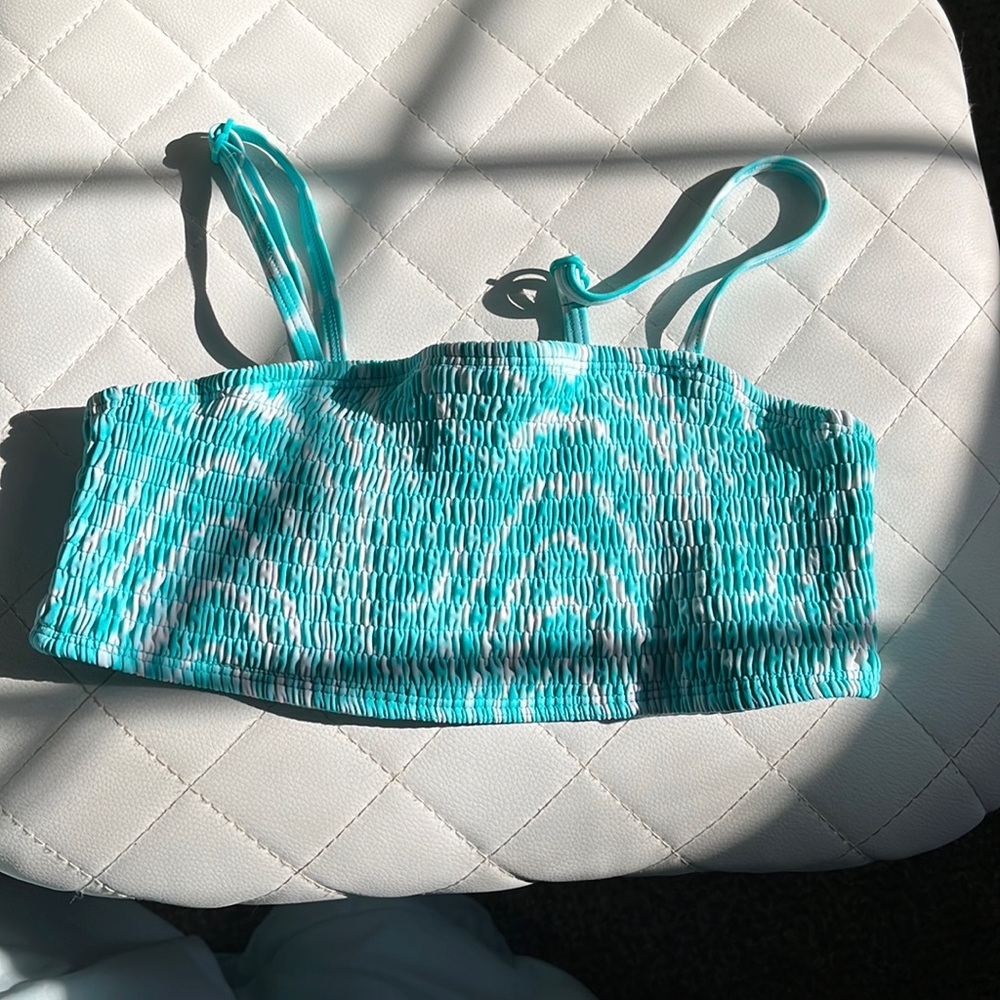 Bikini top, with adjustable straps that come off. Not sold at Justice anymore!